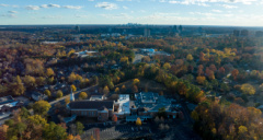 suburban buildings and homes surrounded by trees