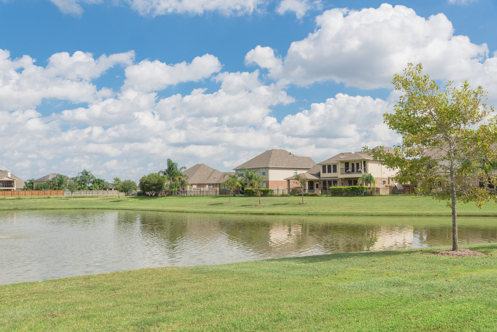 A street of white suburban houses in Pearland, Texas.