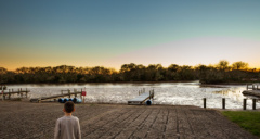 young boy looking out at a lake on the Texas coast